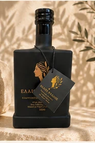 Elaiou Kallos bottle front label in warm light